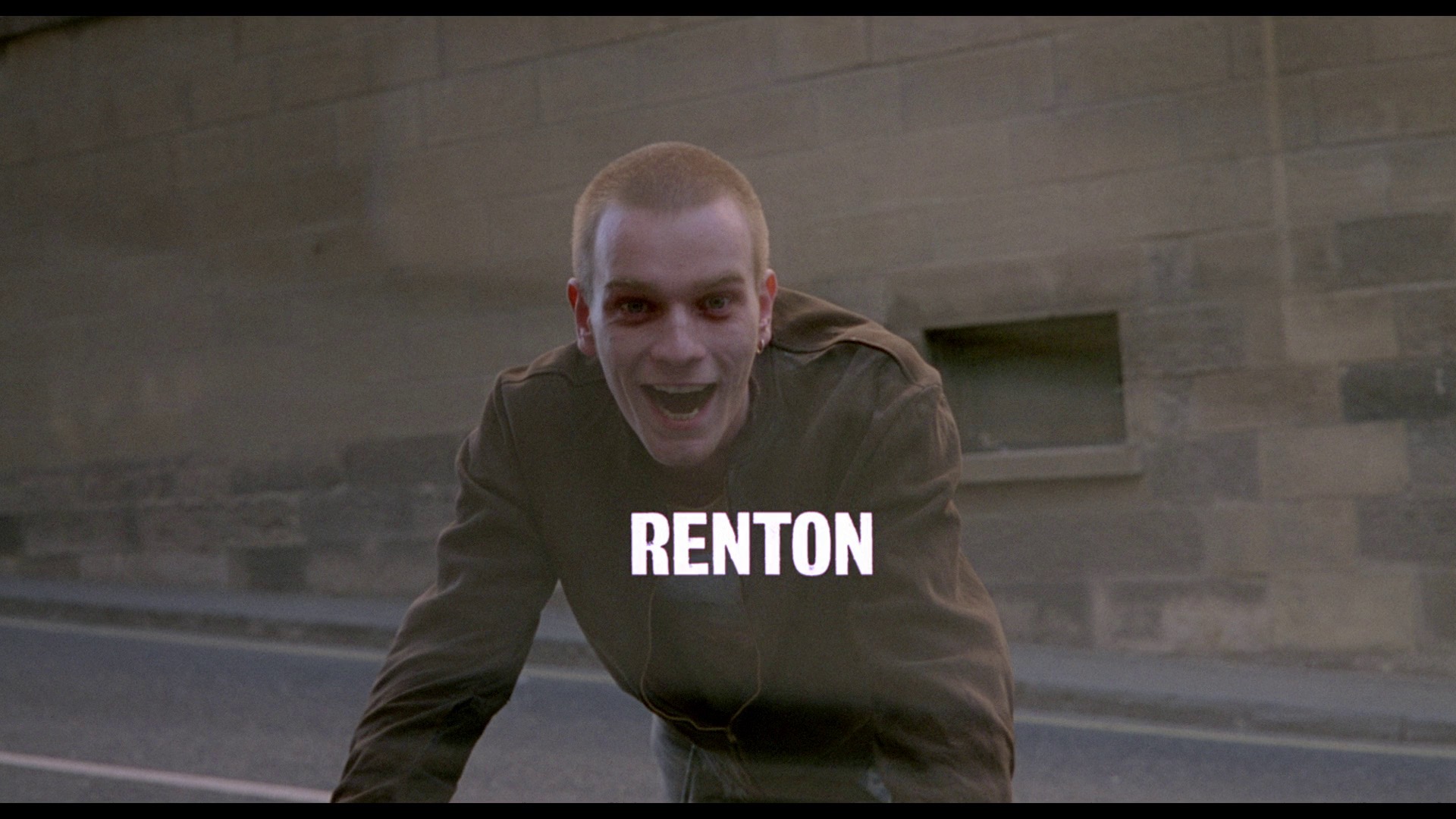 Screenshot from the remastered blu-ray of Trainspotting depicting the title card for Ewan McGregor's character Renton