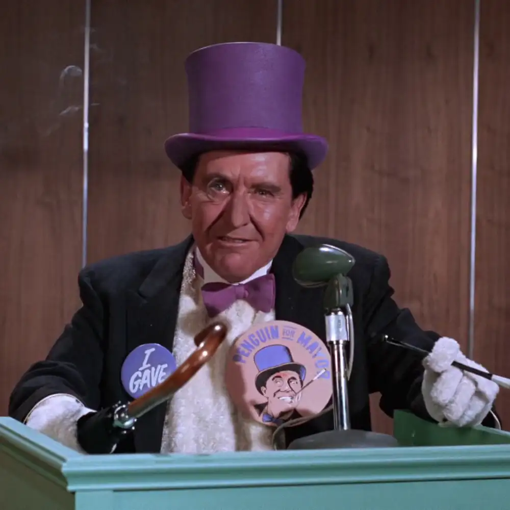 Burgess Meredith as The Penguin running for mayor