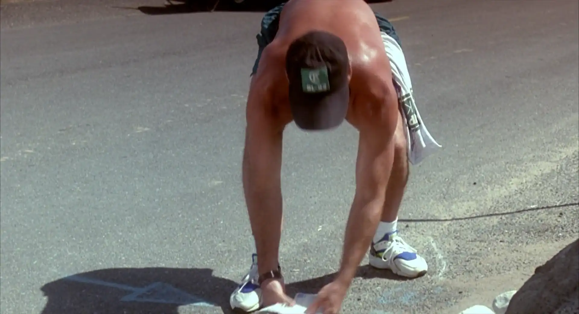 Bruce Willis picking up the mail while wearing Nike Air Huaraches