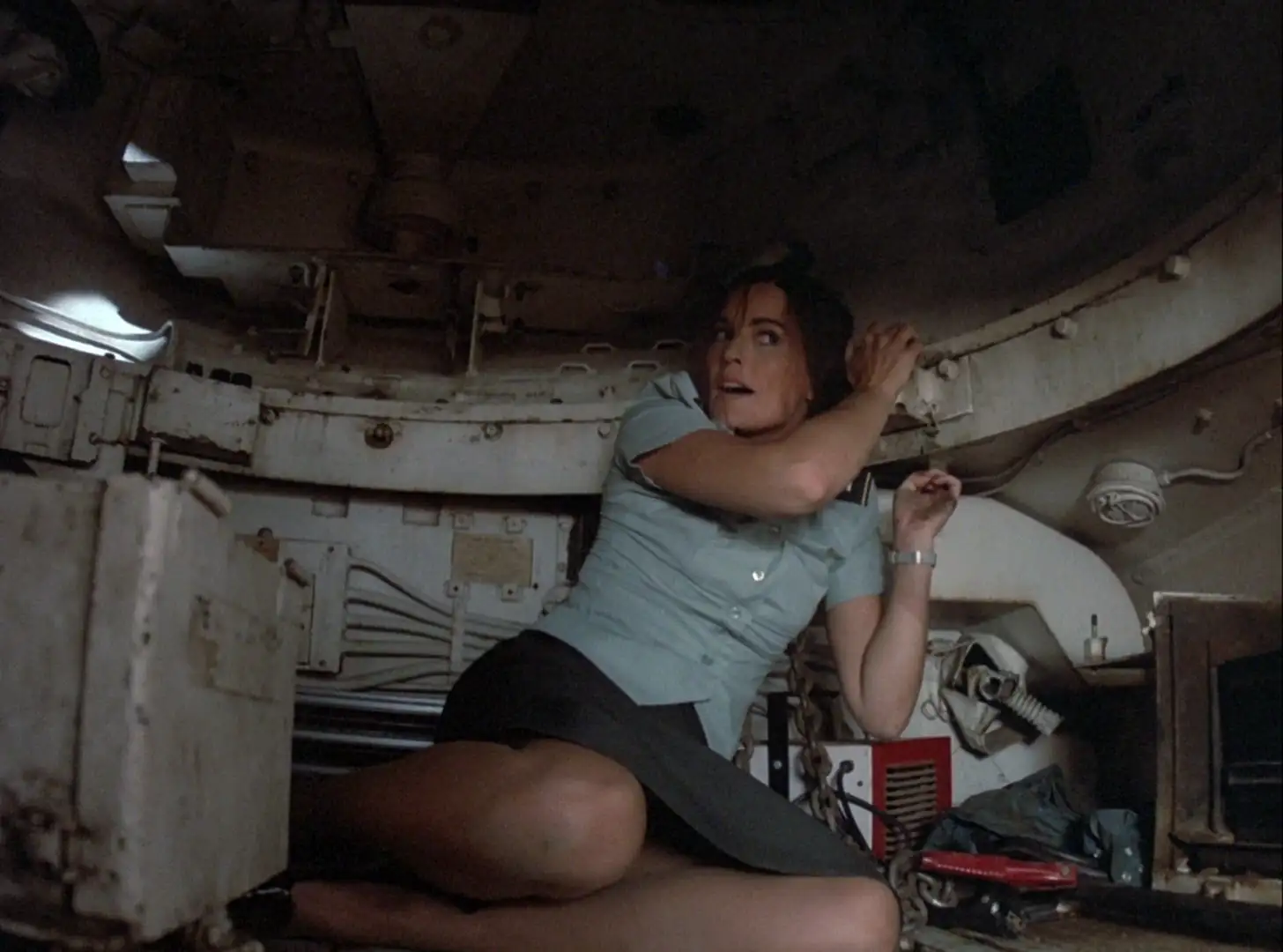 Devon Ericson as Robin Ladd stuck in a tank in Knight Rider: Deadly maneuvers