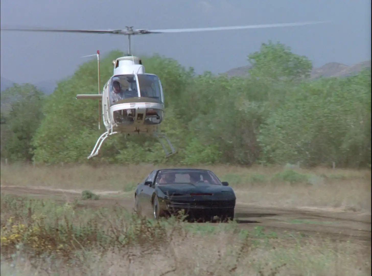 KITT being chased by a helicopter in Knight Rider: Just My Bill cover