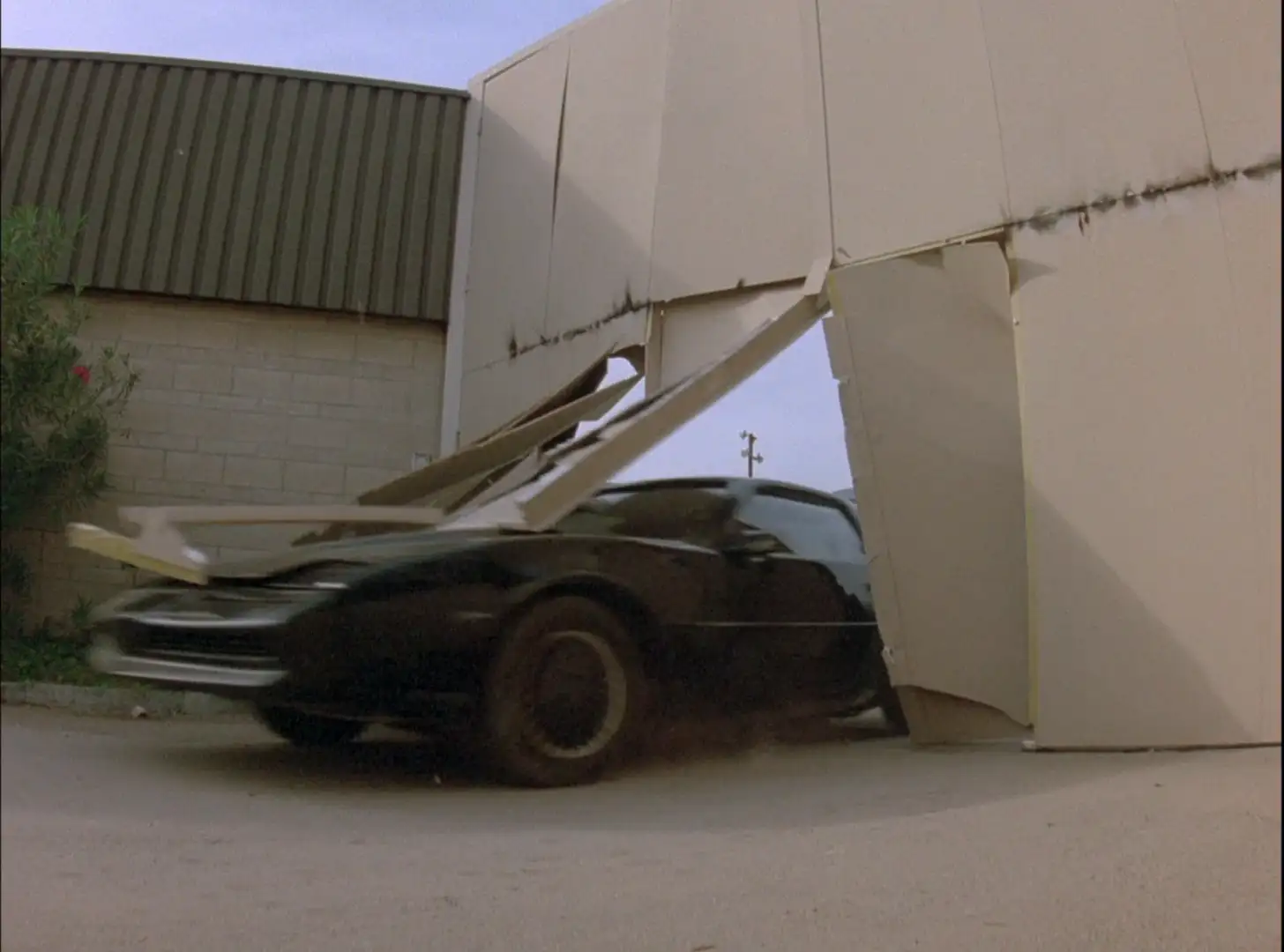 KITT bursts through a wall in Knight Rider: No Big Thing