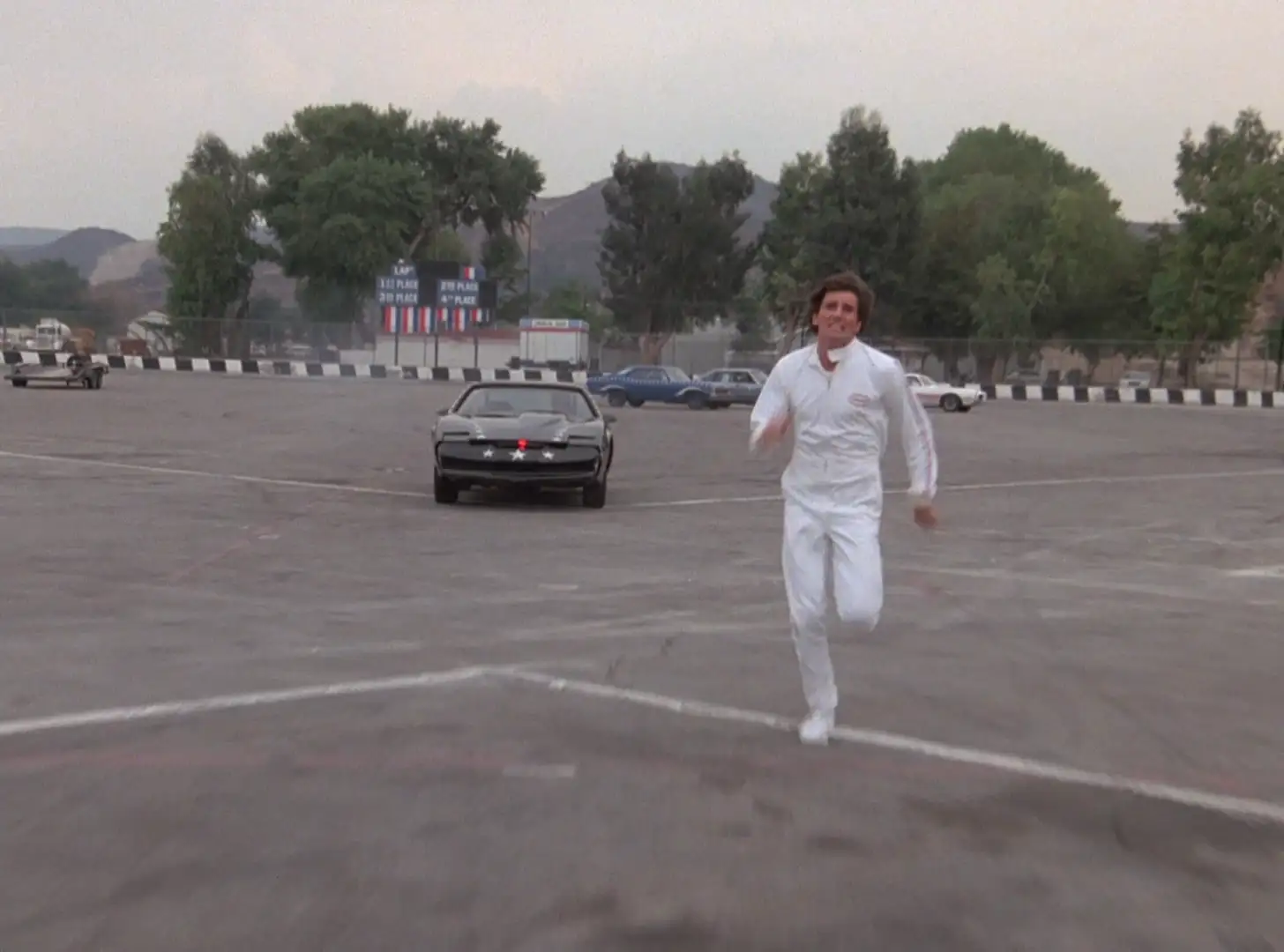 A man running away from KITT in Knight Rider: Slammin' Sammy's Stunt Show Spectacular