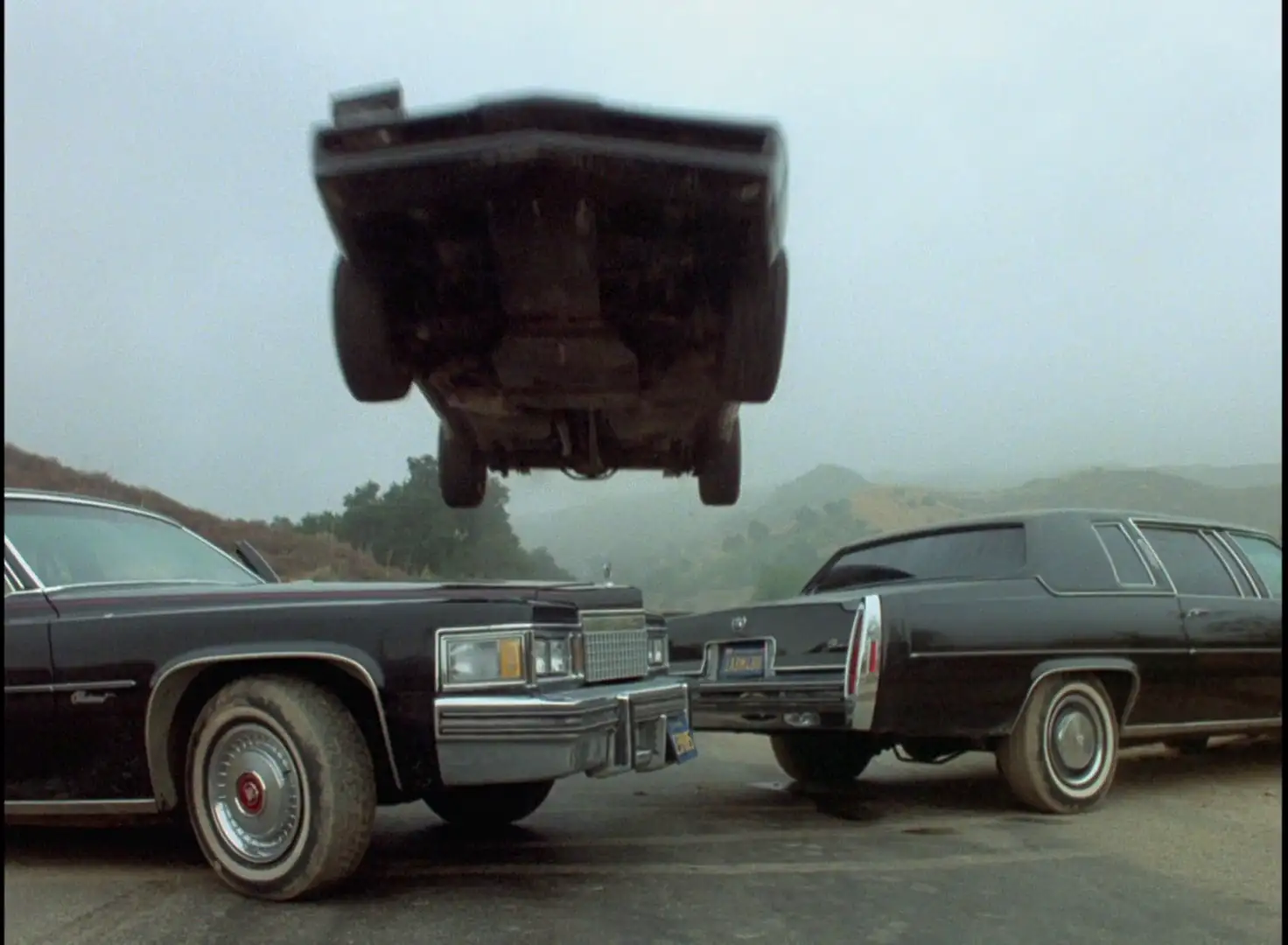 KITT turbo booting over two cars with his floppy headlight out