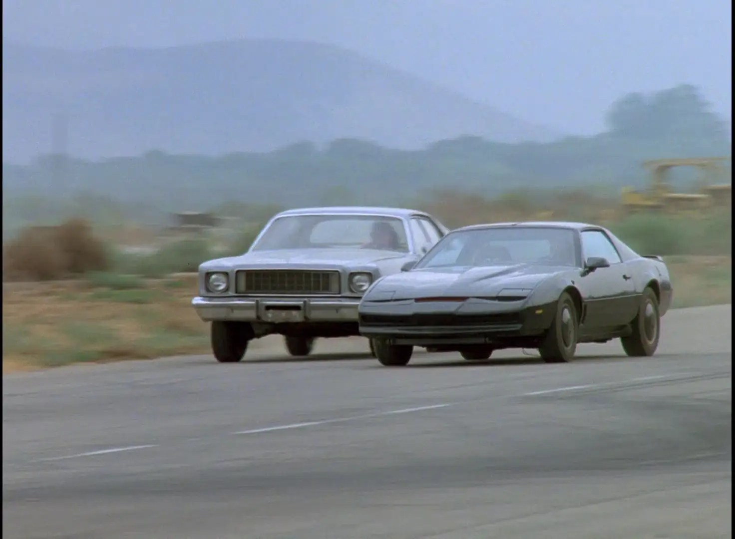 KITT cutting off another car in Knight Rider: A Plush Ride